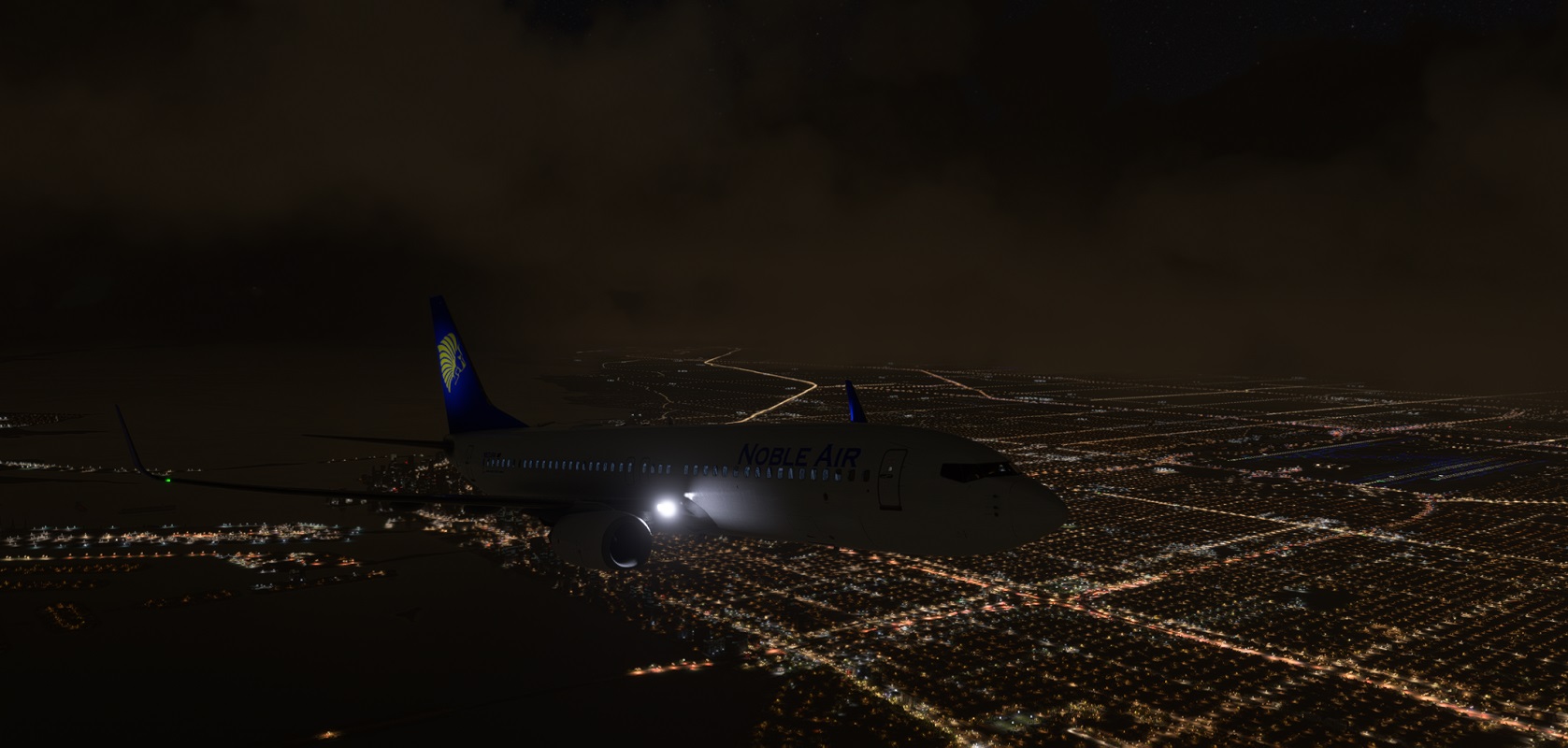A Noble Air 737-800 climbing out of KMIA during a nighttime departure to KTPA.